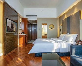 Jinjiang Metropolo Hotel Zhenjiang Railway Station Wanda Plaza - Zhenjiang - Bedroom