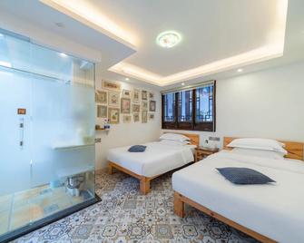 Emerald Adventures Guesthouse - Qiannan - Habitación