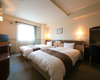 Royal Inn Sendai - Satsumasendai - Slaapkamer