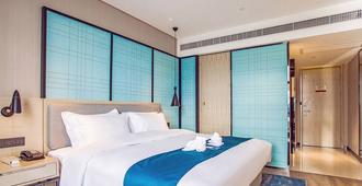 Echarm Hotel Qionghai Wanquanhe Branch - Qionghai - Bedroom