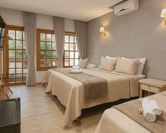 Pousada Flores do Cerrado - פירנופוליס - חדר שינה