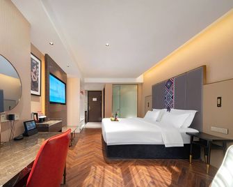 Zhangjiajie Metropolo Hotel - ג'אנגג'יאיי - חדר שינה