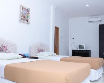 Tirta Kencana Hotel & Cottage - Амбон - Спальня