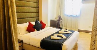 Hotel Prag Continental - Guwahati - Kamar Tidur