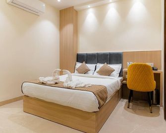 Green Garden Cafe and Hotel - Amritsar - Slaapkamer