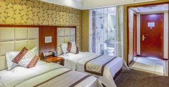 Yihai International Business Hotel - Zhangjiakou - Schlafzimmer