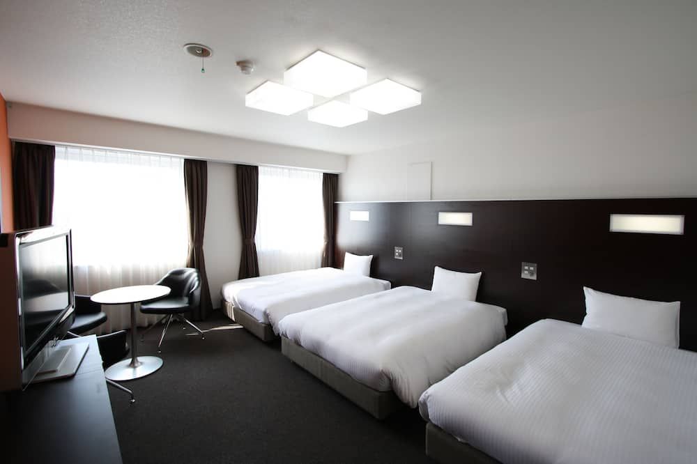 جرين ريتش هوتل سويزينجي - كوماموتو - غرفة نوم