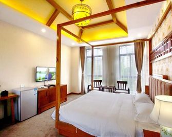 Boyue Xiaozhu Kuanting Hotel - Ляншань - Спальня