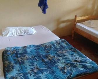 Oki Grand Hotel - Bondo - Bedroom