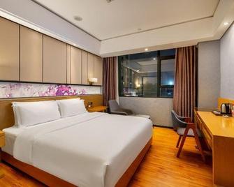 Enjoy Hotels (Guangzhou Sanyuanli Metro Station) - Cantón - Habitación