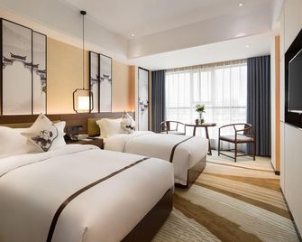 Hebe Xiyue Hotel (Loudi Guanjia Nao) - Loudi - Bedroom