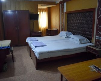 National Hotel - Lahore - Slaapkamer