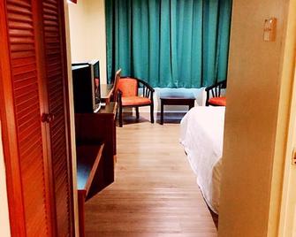 Global Hotel Labuan - Labuan - Bedroom
