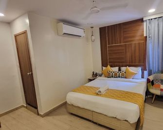 Hotel Hinduja Empire - Surat - Schlafzimmer