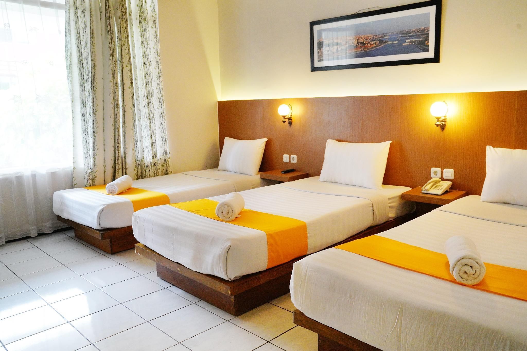 Hotel Metropole - Batu - Schlafzimmer