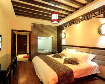 Zhangjiajie Gangyuan Wellness Resort - Zhangjiajie - Bedroom