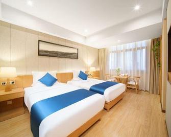 Soaring Dragon Tea Culture Hotel (Hanzhong High-speed Railway Station Wanbang Flagship) - Hanzhong - Спальня