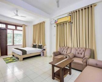 Erica Residency - גוואטי - חדר שינה