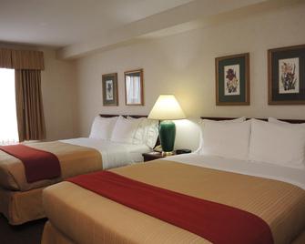 Evergreen Inn and Suites - Monroe - Bedroom