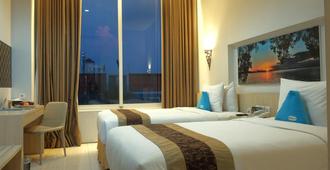 Megaland Hotel Solo - Surakarta - Schlafzimmer