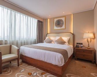 Century Plaza Qidu Hotel - Zibo - Schlafzimmer