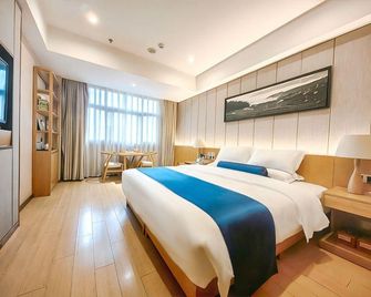 Soaring Dragon Tea Culture Hotel (Hanzhong High-speed Railway Station Wanbang Flagship) - Hanzhong - Спальня