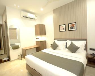 Fabhotel Rama Inn - Ānand - Bedroom