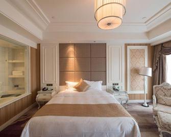 Da Tong Weidu International Hotel - Datong - Schlafzimmer