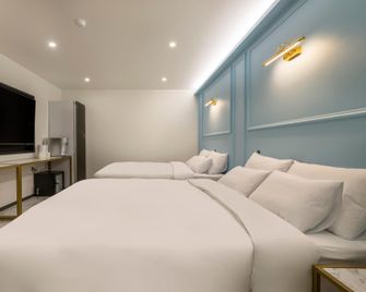 Pohang Sangwon-Dong Eila Hotel - Pohang - Bedroom