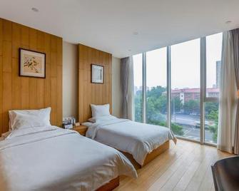 Hesuoyou Hotel Beijing - Pechino - Camera da letto