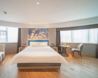 Magnotel Xiangyang Ancient City Tanxi Road - Xiangyang - Camera da letto