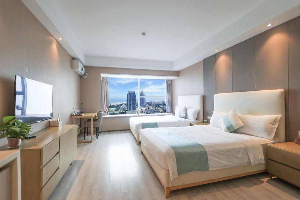 Qingdao Meitu Seaview Resort Apartment (Convention and Exhibition Center Shilaoren Bathing) - تشينغداو - غرفة نوم