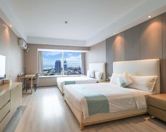 Qingdao Meitu Seaview Resort Apartment (Convention and Exhibition Center Shilaoren Bathing) - Qingdao - Makuuhuone