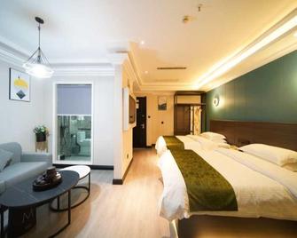 Greentree Alliance Jiangxi Shangrao Yiyang County Zhimin Aveune Yingbin Avenue Hotel - Shangrao - Schlafzimmer