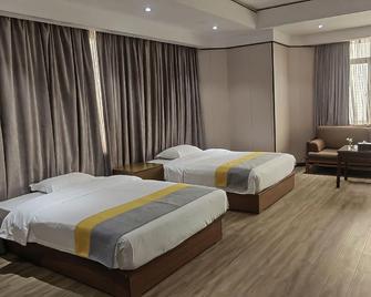 Universal International Hotel - Zhanjiang - Slaapkamer