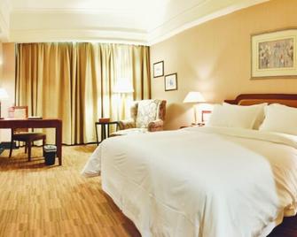 Zhongshan Sunshine Business Hotel (Zhongshan Pedestrian Street Xingzhong Plaza Store) - Zhongshan - Bedroom
