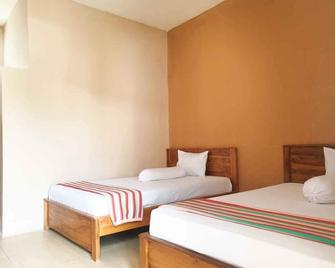 RedDoorz at Hotel Gloria Borong Labuan Bajo - Ruteng - Habitación