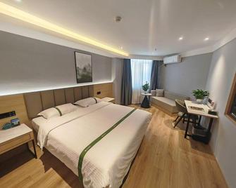 Greentree Inn Zibo Zichuan District Flyover Business Hotel - Zibo - Schlafzimmer