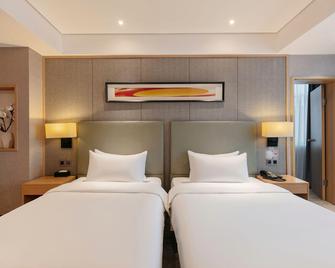 Century Star Holiday Hotel (Nanyang Beijing Avenue Branch) - Nanyang - Bedroom