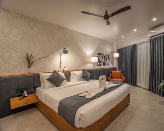 Aura Inn & Suites - Mysore - Slaapkamer