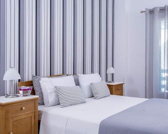 Santellini Hotel - קאמארי - חדר שינה