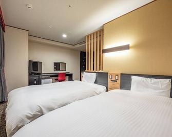 Kagoshima Plaza Hotel Tenmonkan - קאגושימה - חדר שינה