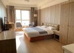 Dalian Yifan Apartment - داليان - غرفة نوم