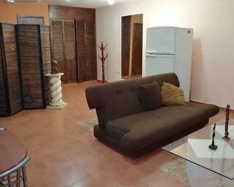 El Remanso a 20 min. De la playa y 10 min. Del Centro de la ciudad. - Mérida - Living room