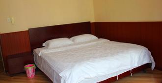 Qingdao Huake Holiday Hotel - Qingdao - Bedroom
