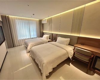 Xishe Hotel (Pangdonglai Sanpang Branch) - Xinxiang - Schlafzimmer