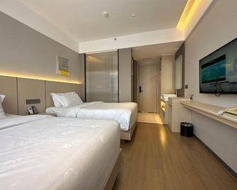 Jintian Business Hotel - Kuang-jüan - Ložnice