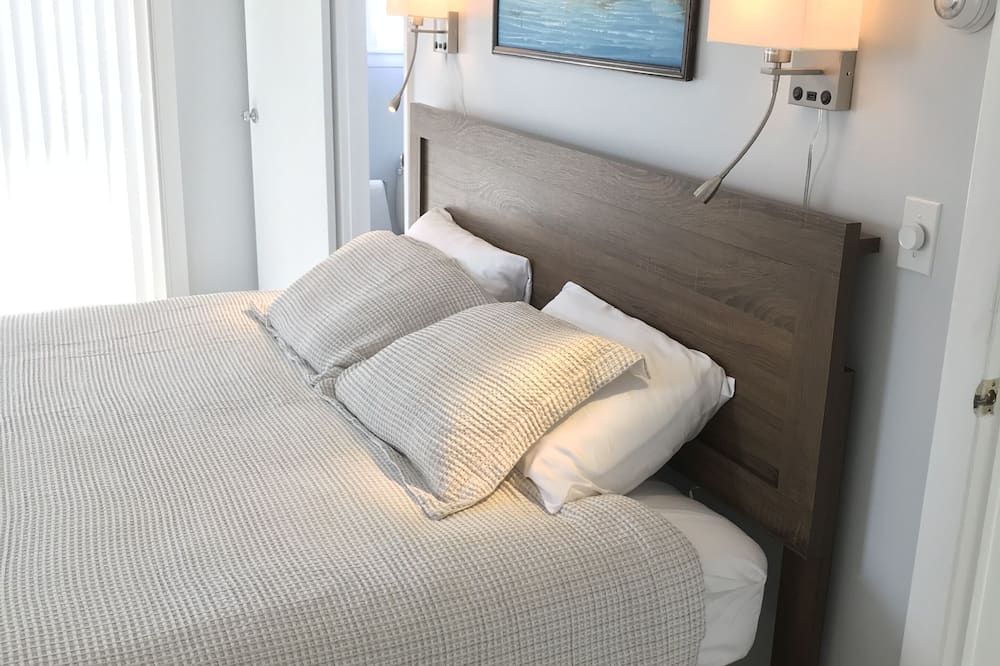 Bedroom view of 2bed/2bath with water views, large deck, walking distance to beach/restaurants