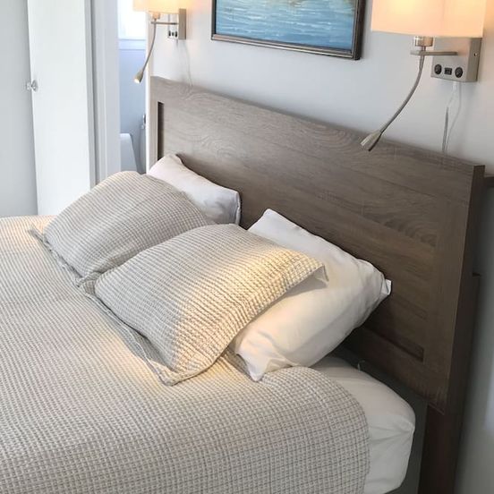 Bedroom view of 2bed/2bath with water views, large deck, walking distance to beach/restaurants