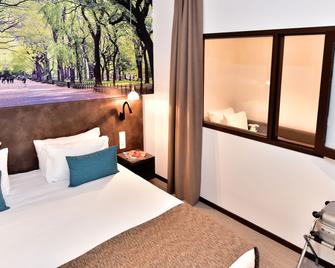 Central Park Hôtel & Spa - לה רושל - חדר שינה
